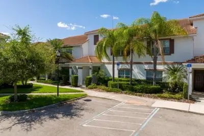 an empty parking lot in front of a house at 4 Bedrooms3 Bathrooms at Storey Lake Resort in Kissimmee