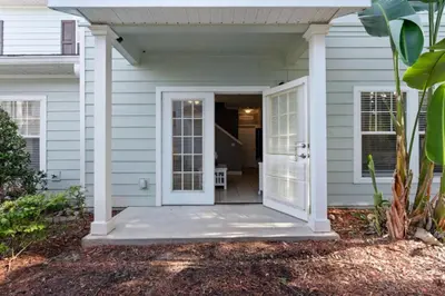 a house with a white door and a porch at Perfect Gateway to Disney 9108 in Kissimmee