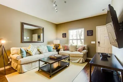 a living room with a couch and a table at Your VIP Home near Disney 25107 in Kissimmee