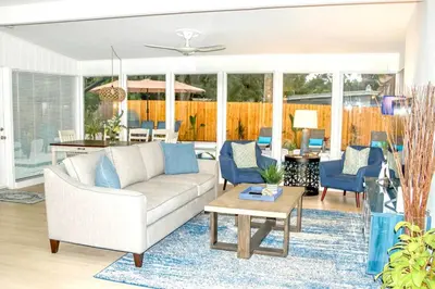 a living room with a couch and a table at Exquisite Luxury Villa with Pool in Prime Location in Orlando