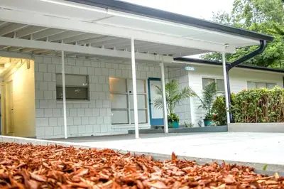 a building with awning and a pile of leaves at Exquisite Luxury Villa with Pool in Prime Location in Orlando