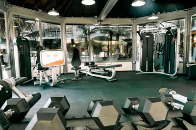 a gym with several treadmills and exercise equipment at Modern 1BED 1BA Gem in Great Location Free Parking in Kissimmee