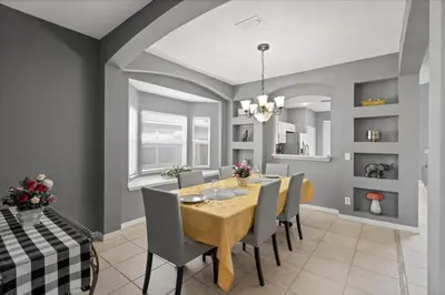 a dining room with a table and chairs at Family Fun Kissimmee Retreat in Kissimmee
