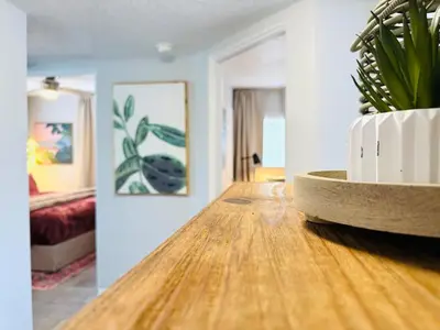 a room with a table with a potted plant on it at 3BR Oasis DT ORL, Full Kitchen & Fenced Yard! in Orlando