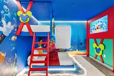 a childrens bedroom with a shark theme and a bunk bed at New Home 04 Bedrooms At Storey Lake in Kissimmee