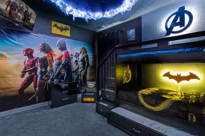 a room with a superhero mural on the wall at 2817 Storey Lake Kissimmee in Kissimmee