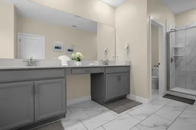 a bathroom with a double sink and a shower at Disney Vacation Villa Pool & BBQ & Resort Clubhouse in Kissimmee