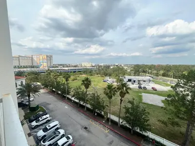 a parking lot with cars parked in a parking lot at Universal-Disney Dream 606S - 1 Bedroom in Orlando