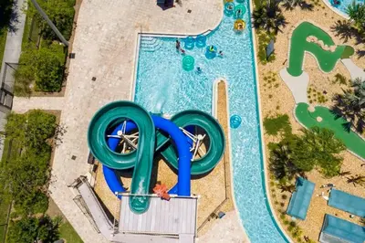 an overhead view of a pool with a water slide at Viva o Luxo – 5 Quartos e Piscina no Resort in Kissimmee