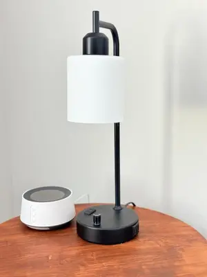 a black lamp sitting on top of a table at Boho retreat close to Disney! in Kissimmee