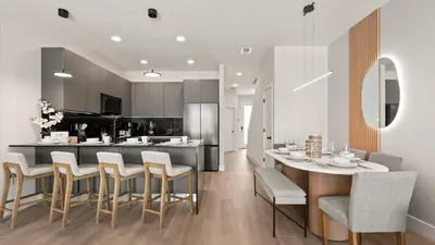 a kitchen and dining room with a table and chairs at Upstay-Luxury 3BR Home w Private Pool & Games Room in Orlando