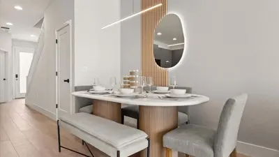 a dining room with a table with chairs and a mirror at Upstay-Luxury 3BR Home w Private Pool & Games Room in Orlando