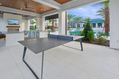 a ping pong table in the middle of a kitchen at Kissimmee Oasis in Orlando