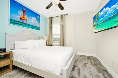 a bedroom with a white bed and a window at Cheerful Villa Near Disney With Margaritaville Resort And Island H20 Waterpark Access - 2913Cs in Orlando
