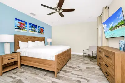 a bedroom with a bed and a ceiling fan at Cheerful Villa Near Disney With Margaritaville Resort And Island H20 Waterpark Access - 2913Cs in Orlando