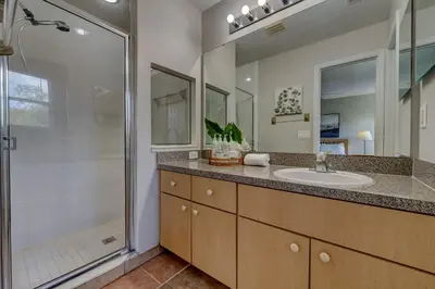 a bathroom with a sink and a shower at Cozy Vacation Retreat in Fiesta Key Community in Kissimmee