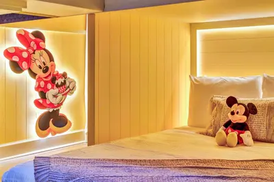 a bedroom with two mickeys sitting on a bed at 15 Bedrooms 165 Bathrooms Sonoma 4081 Sb in Kissimmee