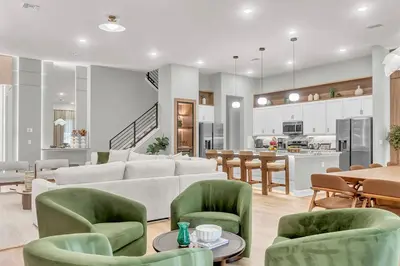 a living room with a couch and chairs and a kitchen at 15 Bedrooms 165 Bathrooms Sonoma 4081 Sb in Kissimmee