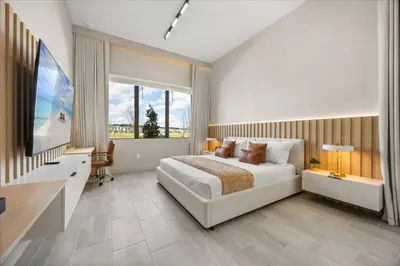 a bedroom with a bed and a flat screen tv at 15 Bedrooms 165 Bathrooms Sonoma 4171Sb in Kissimmee