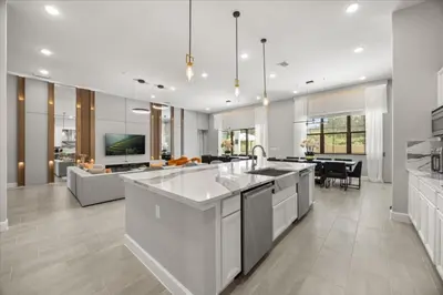 a kitchen and living room with a couch and a table at 15 Bedrooms 165 Bathrooms Sonoma 4171Sb in Kissimmee