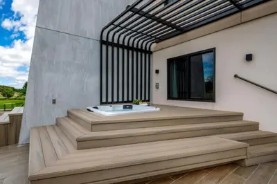 a bathroom with a tub on a wooden deck at Elegant Orlando Getaway Close To Disney in Kissimmee