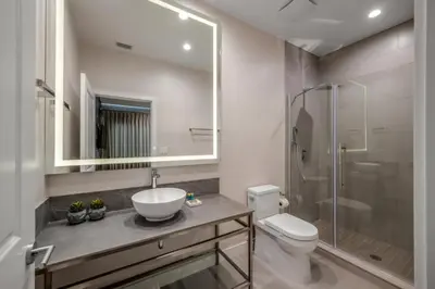 a bathroom with a sink and a toilet and a shower at Luxury Family Townhouse Near Disney & Dining in Kissimmee