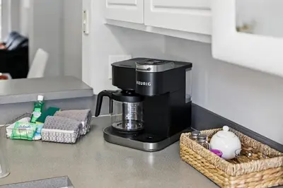 a coffee maker on a counter in a kitchen at Family Escape Near Disney Serene Retreat in Terra Verde Resort in Kissimmee