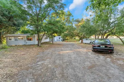 a car parked in the driveway of a house at Orlando 3BR | Hot Tub + Parking + Pets in Orlando
