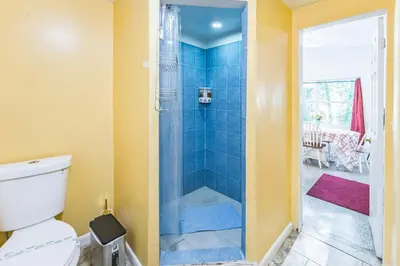 a bathroom with a shower with a toilet at Orlando 3BR | Hot Tub + Parking + Pets in Orlando