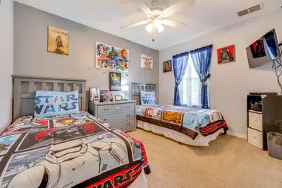 two beds in a bedroom with a star wars bedroom at 10 Mi to Disney Parks Resort Retreat with Patio in Kissimmee