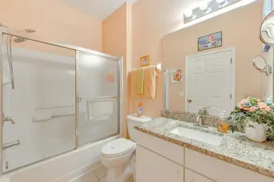a bathroom with a toilet and a shower and a sink at 10 Mi to Disney Parks Resort Retreat with Patio in Kissimmee