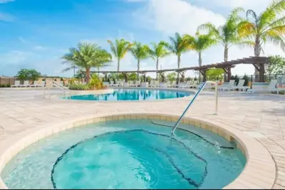 a pool at a resort with palm trees at 3204 GL - Serene Lucaya Oasis Retreat in Kissimmee