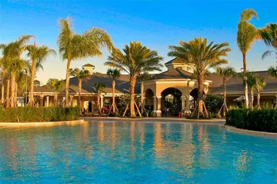 a resort with palm trees and a swimming pool at Water Park & Fantastic Pool only Minutes To Walt Disney World's Front Gate!!! in Orlando