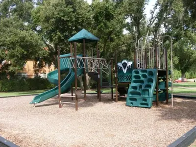 a playground with a slide in a park at Amazing 4 Bedrooms- Near Disney in Kissimmee