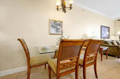 a dining room with a table and chairs at Luxurious Condo near DisneyLand in Orlando