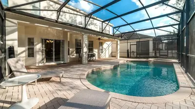 a swimming pool in a house with a glass roof at MNL2696 in Orlando