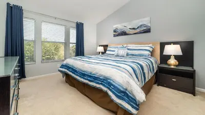a bedroom with a bed and a window at MSW2537 in Orlando