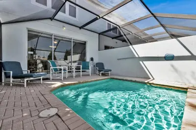 a swimming pool in a house with a patio at MSW2549 in Orlando