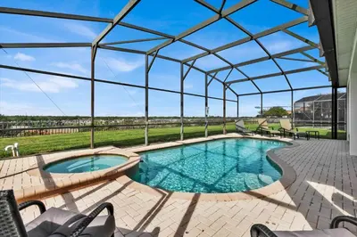 a swimming pool with a glass canopy over it at AF2574 - Windsor Hills Resort Vacation Home in Orlando
