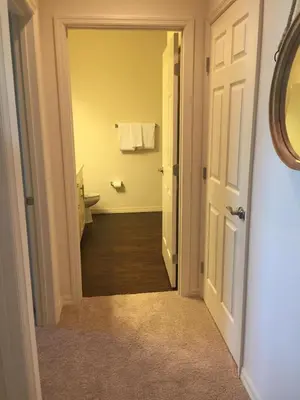 an open door to a bathroom with a toilet at 3BR Townhome West Lucaya Resort Close to Disney in Kissimmee