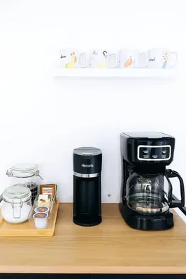 a coffee maker sitting on a wooden counter top at Beauty 4 miles to Disney 3Br 2Ba Pool Home in Kissimmee
