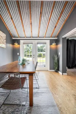 a dining room with a wooden table and chairs at Massive 3 bedroom with large backyard in Orlando