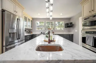 a kitchen with a large counter with a sink at Massive 3 bedroom with large backyard in Orlando