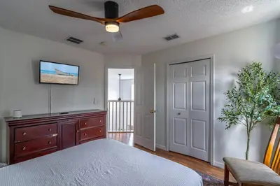 a bedroom with a bed and a ceiling fan at 8512 Emerald Island in Kissimmee