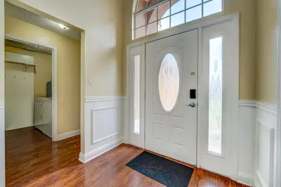 a white door in a room with a window at Sun Kissed Pool Home in Kissimmee in Kissimmee