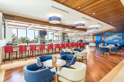 a restaurant with tables and chairs and a bar at Coral Cottage With Private Pool Near Disney With Margaritaville Resort And Island H20 Waterpark Access - 2946Sr in Orlando