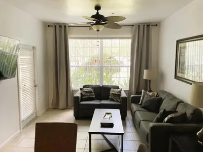 a living room with a couch and a table at Family Friendly II in Orlando