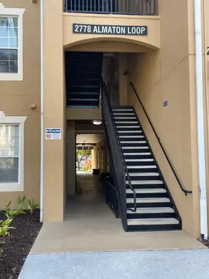 a stairway leading into a building with ansicsnsicsnsicsnsicsnsicsnsicsnsics at Family Friendly II in Orlando
