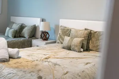 a bedroom with a large bed and a couch at Amzing location 3BDR House - 8980 in Kissimmee