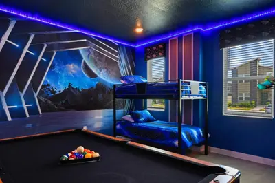 a room with a bed and a pool table at 2900SS SL Family Lakeview Escape Disney-Themed Fun 8 Mins to Parks in Kissimmee